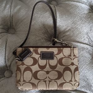 Brown Coach logo wristlet